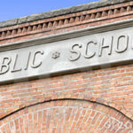 public-school-sign-brick-building-5310531